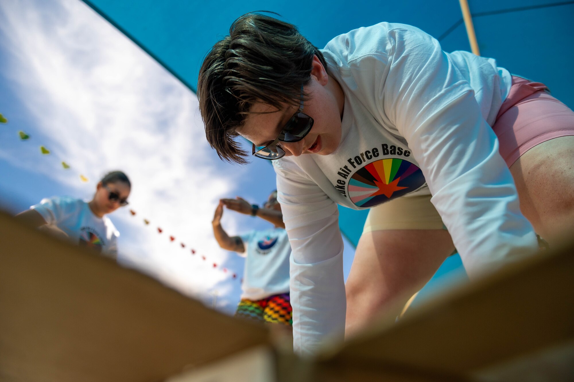 U.S. Air Force Airman 1st Class Bailey Sherman, 56th Component Maintenance Squadron network infrastructure technician, builds a cardboard boat during a Pride Month event hosted by the Luke Pride Committee, June 9, 2023, at Luke Air Force Base, Arizona.