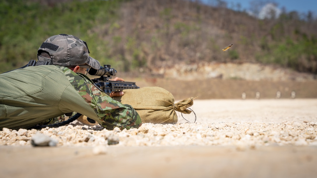 A Fuerzas Comando competitor takes a shot at the range, June, 12, 2023 in Sierra Prieta, Santo Domingo.