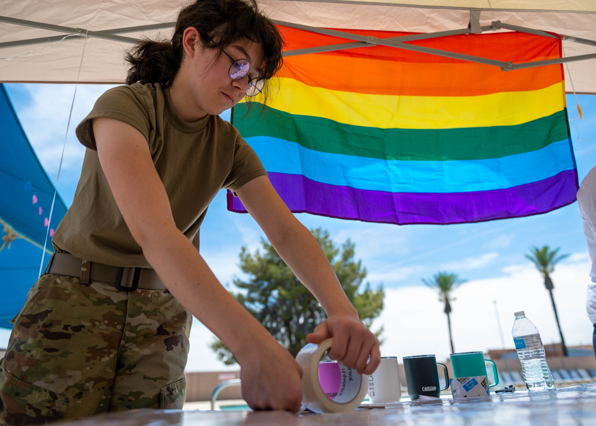 U.S. Air Force Airman 1st Class Ysabella Paris, 56th Comptroller Maintenance fuel maintenance technician, participates in a cardboard boat race event in honor of Pride Month, June 9, 2023, at Luke Air Force Base, Arizona.