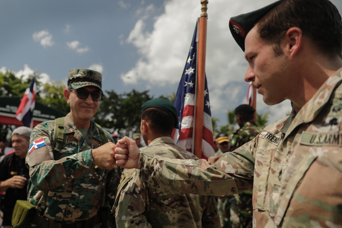 Lt. Gen. Carlos Luciano Díaz Morfa, minister of defense of the Dominican Republic, greets a U.S. Army Special Forces Soldier at the opening ceremony for Fuerzas Comando 23 at Santo Domingo, Dominican Republic, June 12 2023.