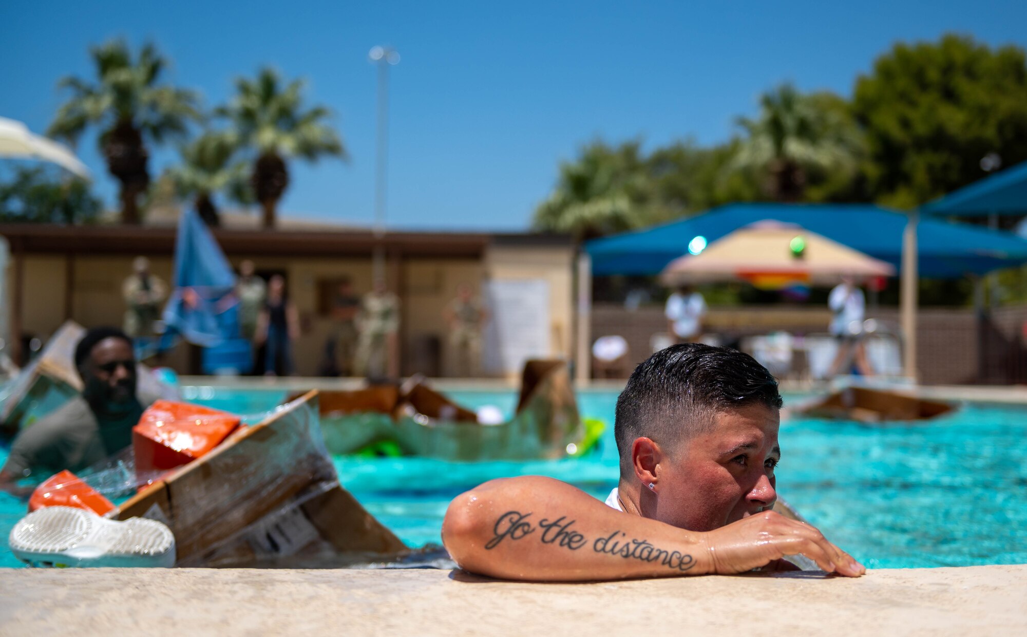 U.S. Air Force Master Sgt. Melissa Lord, 56th Component Maintenance Squadron fuels section chief, finishes first place after a cardboard boat race for a Pride Month event hosted by the Luke Pride Committee, June 9, 2023, at Luke Air Force Base, Arizona.