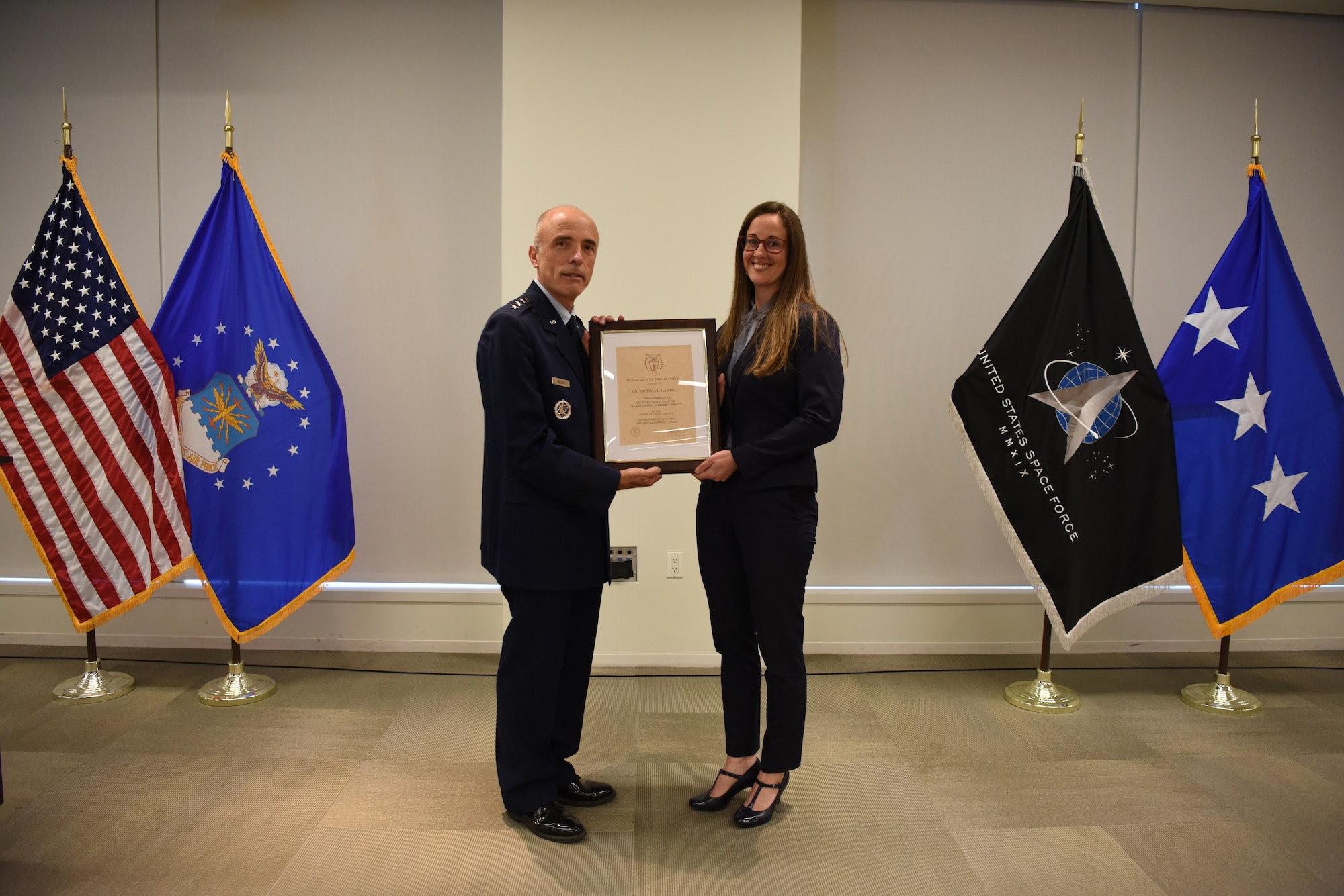 Image of an Airman honoring a civilian.