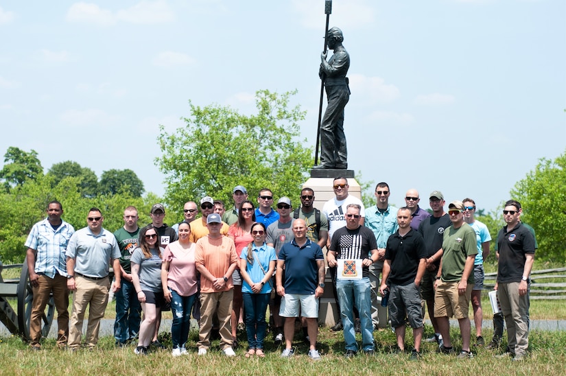 Soldiers with Headquarters and Headquarters Company, 166th Regiment Regional Training Institute pose for a photo during an educational visit to Gettysburg National Military Park in Gettysburg, June 10, 2023. (U.S. Army National Guard photo by 1st Lt. Lindsey Boughter)