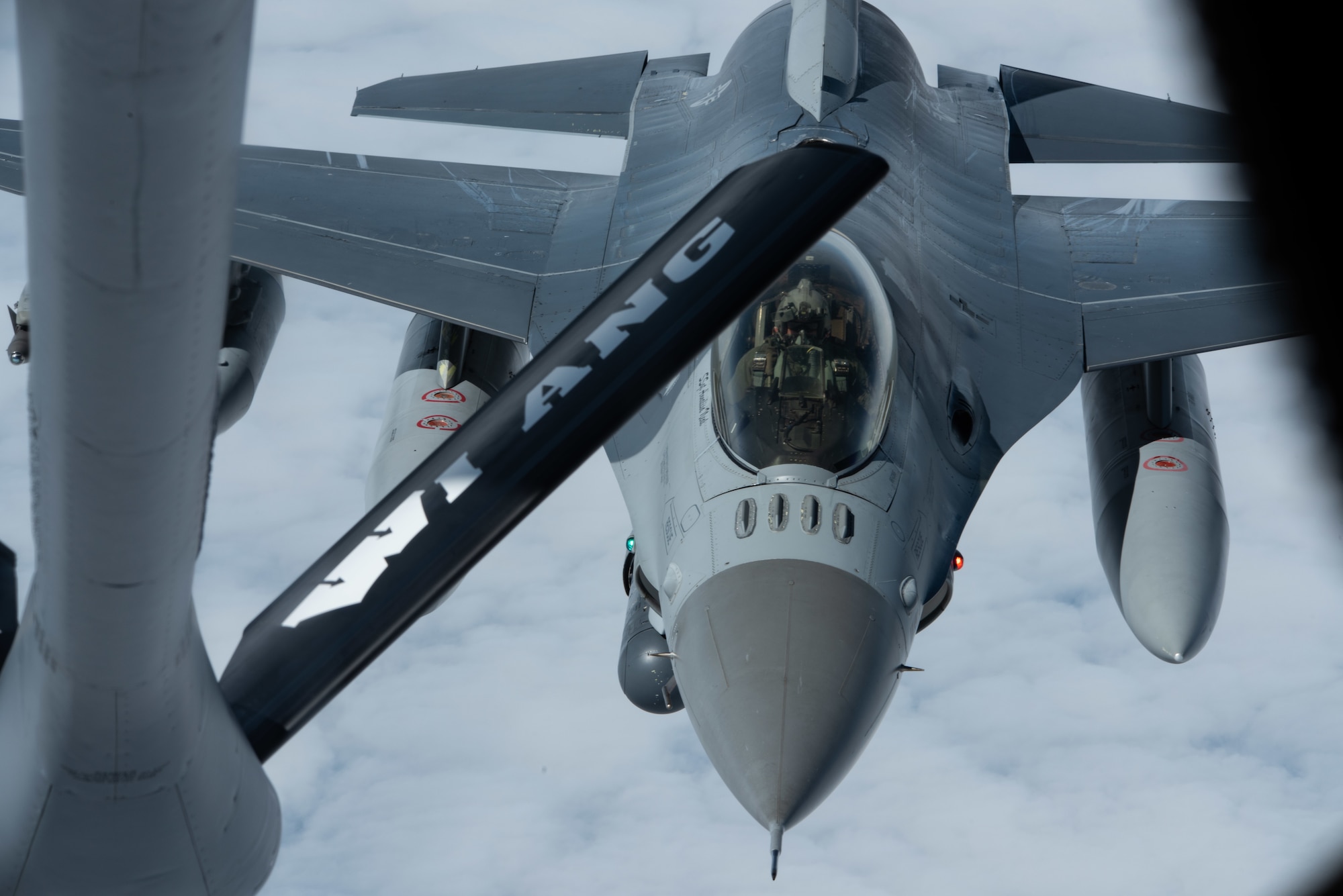 A U.S. Air Force F-16 Fighting Falcon with the 140th Wing, Colorado National Guard, approaches a KC-135 Stratotanker from the 128th Air Refueling Wing, Wisconsin National Guard, as it prepares to receive fuel as part of an air bridge in preparation for exercise Air Defender 2023 over the Atlantic Ocean, June 3, 2023. Air Defender 2023, running June 12-23, is the largest air forces redeployment exercise since NATO was founded, integrating both U.S. and allied airpower to defend shared values, while leveraging and strengthening vital partnerships to deter aggression around the world. (U.S. Air National Guard photo by Master Sgt. Kellen Kroening)