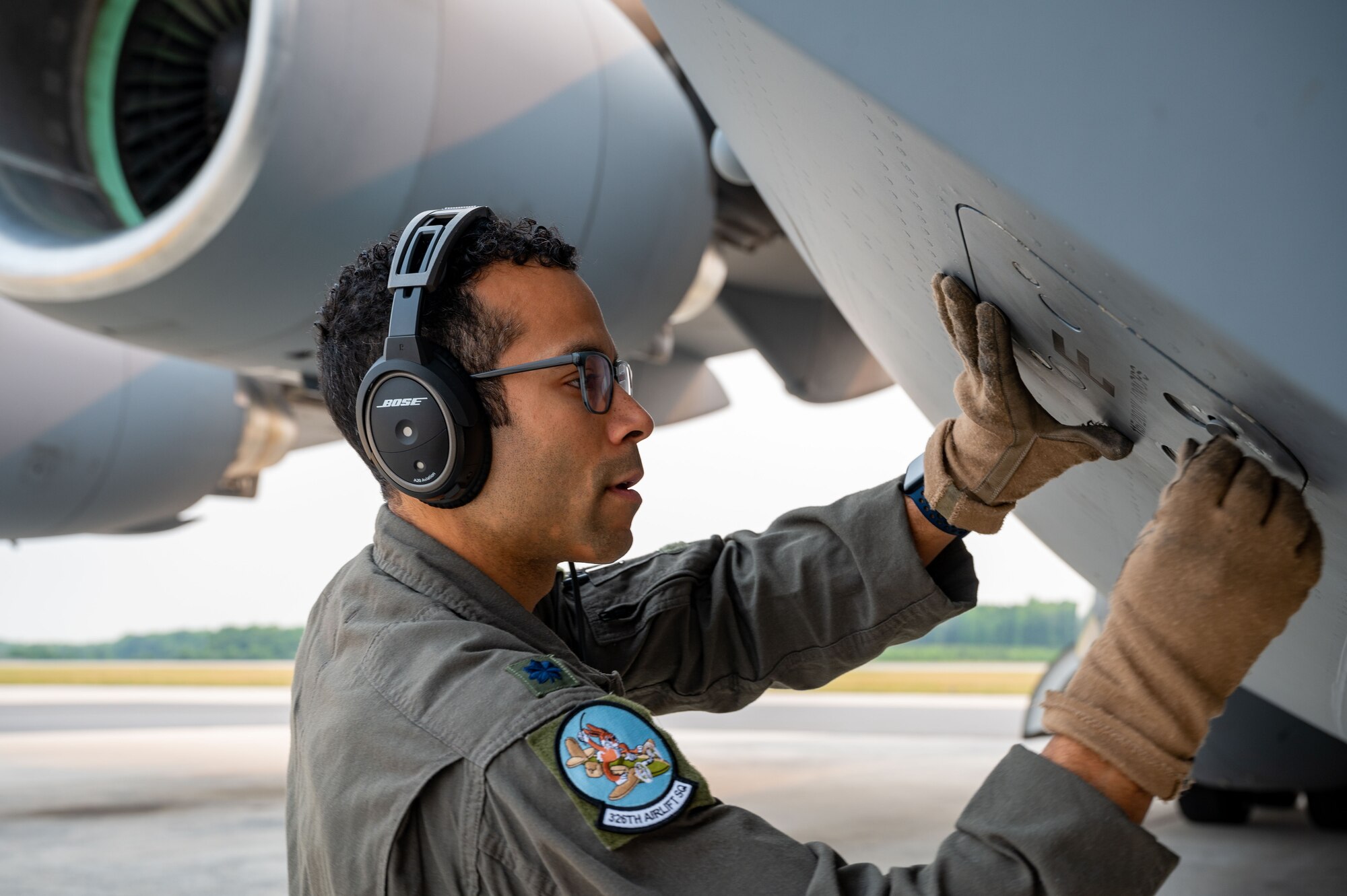 Lt. Col. Ryan Cox, 326th Airlift Squadron pilot, performs a preflight inspection on a C-17 Globemaster III during the 2023 hurricane evacuation exercise at Dover Air Force Base, Delaware, June 6, 2023. The C-17 was one of six Globemaster IIIs that departed Dover AFB during the hurricane evacuation exercise. (U.S. Air Force photo by Airman 1st Class Amanda Jett)