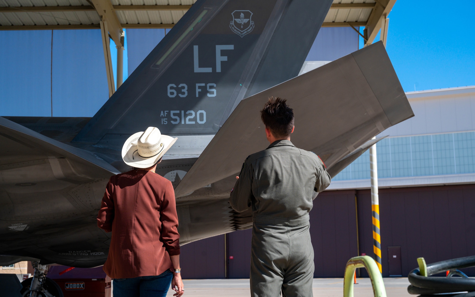 U.S. Air Force Capt. Zachariah Mertes, 63rd Fighter Squadron instructor pilot, shows Arizona state Sen. Janae Shamp, Arizona district 29 senator, an F-35A Lightning II, June 9, 2023, at Luke Air Force Base, Arizona.