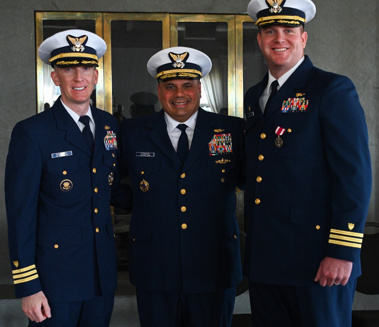 From left, U.S. Coast Guard Cdr. Steven Baldovsky, commanding officer, Alex Haley, Vice Adm. Andrew J. Tiongson, commander, Pacific Area, and Cdr. Brian Whisler, pose for a photo during a change-of-command ceremony at Base Kodiak, June 13, 2023. The change-of-command ceremony is a historic Coast Guard and Naval tradition, which has remained unchanged for centuries and includes the reading of the command orders in the presence of all unit crewmembers. U.S. Coast Guard photo by Petty Officer 3rd Class Ian Gray.