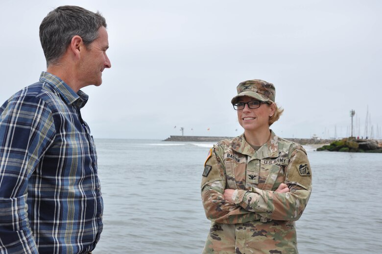 U.S. Army Corps of Engineers Los Angeles District commander Col. Julie Balten and Santa Barbara harbor master Mike Wiltshire discuss an ongoing dredging project aboard a harbor patrol boat May 23 en route to dredger Sandpiper in Santa Barbara, California. Balten met with harbor officials as part of a tour of Corps coastal projects May 22-25.