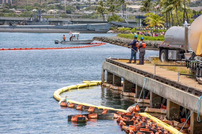 Joint Task Force-Red Hill (JTF-RH) and spill response personnel perform and observe a spill response exercise on Joint Base Pearl Harbor-Hickam, Hawaii, June 8, 2023.