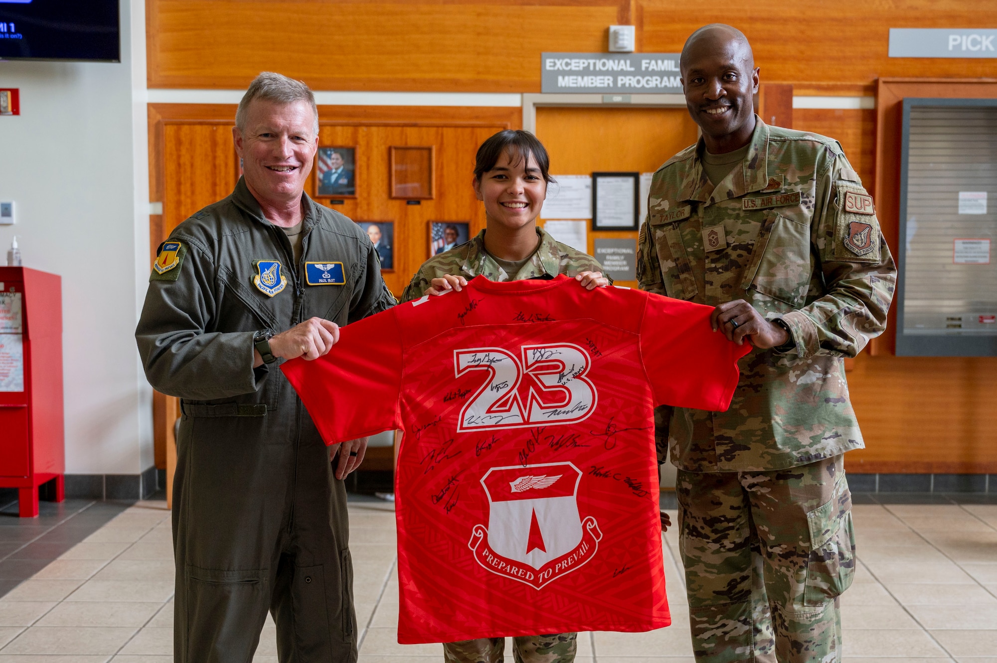 U.S. Air Force Senior Airman Alexandra Santos, dental prophylaxis technician assigned to the 36th Occupational Medical Readiness Squadron, receives the Linebacker of the Week Award from U.S. Air Force Brig. Gen. Paul Fast, commander of the 36th Wing, and U.S. Air Force Chief Master Sgt. Nicholas Taylor, the command chief of the 36th Wing, at Andersen Air Force Base, Guam, June 7, 2023. The Team Andersen Linebacker of the Week recognizes outstanding enlisted, officer, civilian and total force personnel who have had an impact on achieving Team Andersen’s mission, vision and priorities. (U.S. Air Force photo by Airman 1st Class Emily Saxton)