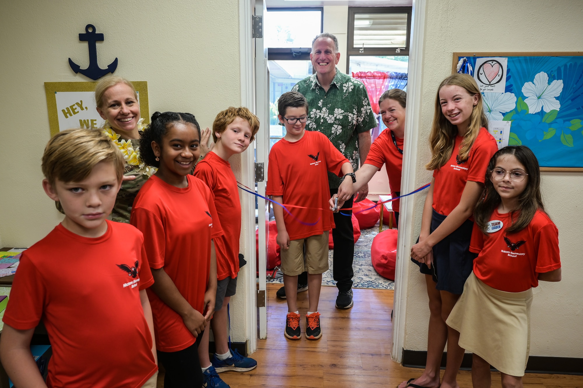 Lt. Col. Horace Meek Hickam Elementary School members and Col. Michele Lo Bianco, 15th Wing commander, pose for a photo during a ribbon cutting ceremony for a resiliency room at Hickam Elementary on Joint Base Pearl Harbor-Hickam, Hawaii, May 31, 2023. The room and garden were designed by children from the school and built with the intention of helping students cope with stress. (U.S. Air Force photo by Staff Sgt. Alan Ricker)