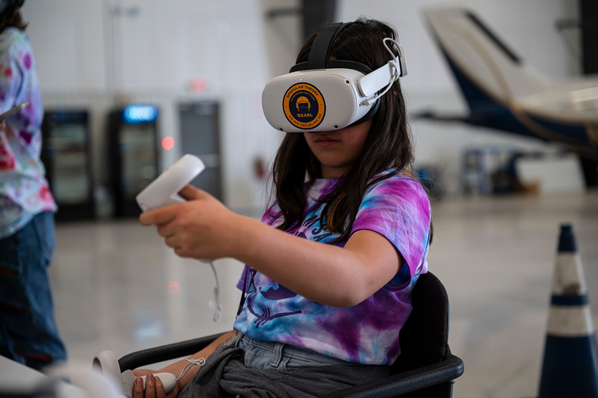 A girl wears a virtual reality headset.