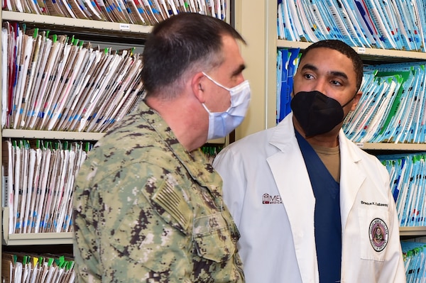 Rear Adm. Matthew Case, commander, Naval Medical Forces Atlantic (NMFL) and director, Tidewater Market, speaks with Cmdr. Brandon Callaway, the dental department head, during a tour of Adm. Joel T. Boone Branch Health Clinic onboard Joint Expeditionary Base Little Creek-Fort Story.