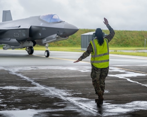 Crew Chief marshals an F-35.