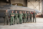 Group of pilots in front of F-22