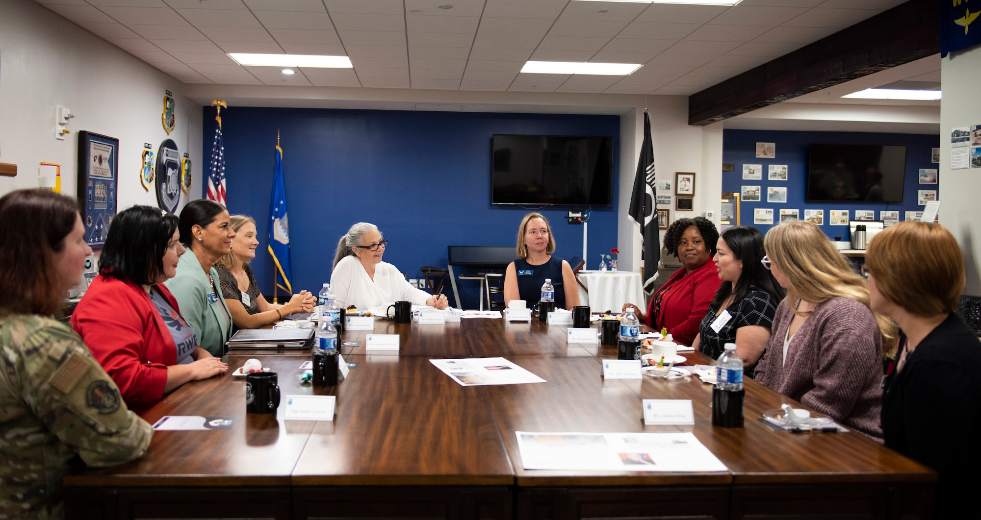 Mrs. Christine Grady (center, in white), wife of Admiral Christopher W. Grady, Vice Chairman of the Joint Chiefs of Staff, listens and takes notes as a family member from the Air Force Technical Applications Center shares her experiences of being a military spouse.  Mrs. Grady accompanied her husband to the nuclear treaty monitoring center, headquartered at Patrick Space Force Base, Fla., June 9, 2023 to talk about topics such as health care, family balance, deployments and separations, childcare, and spouse networking. (U.S. Air Force photo by Matthew S. Jurgens)