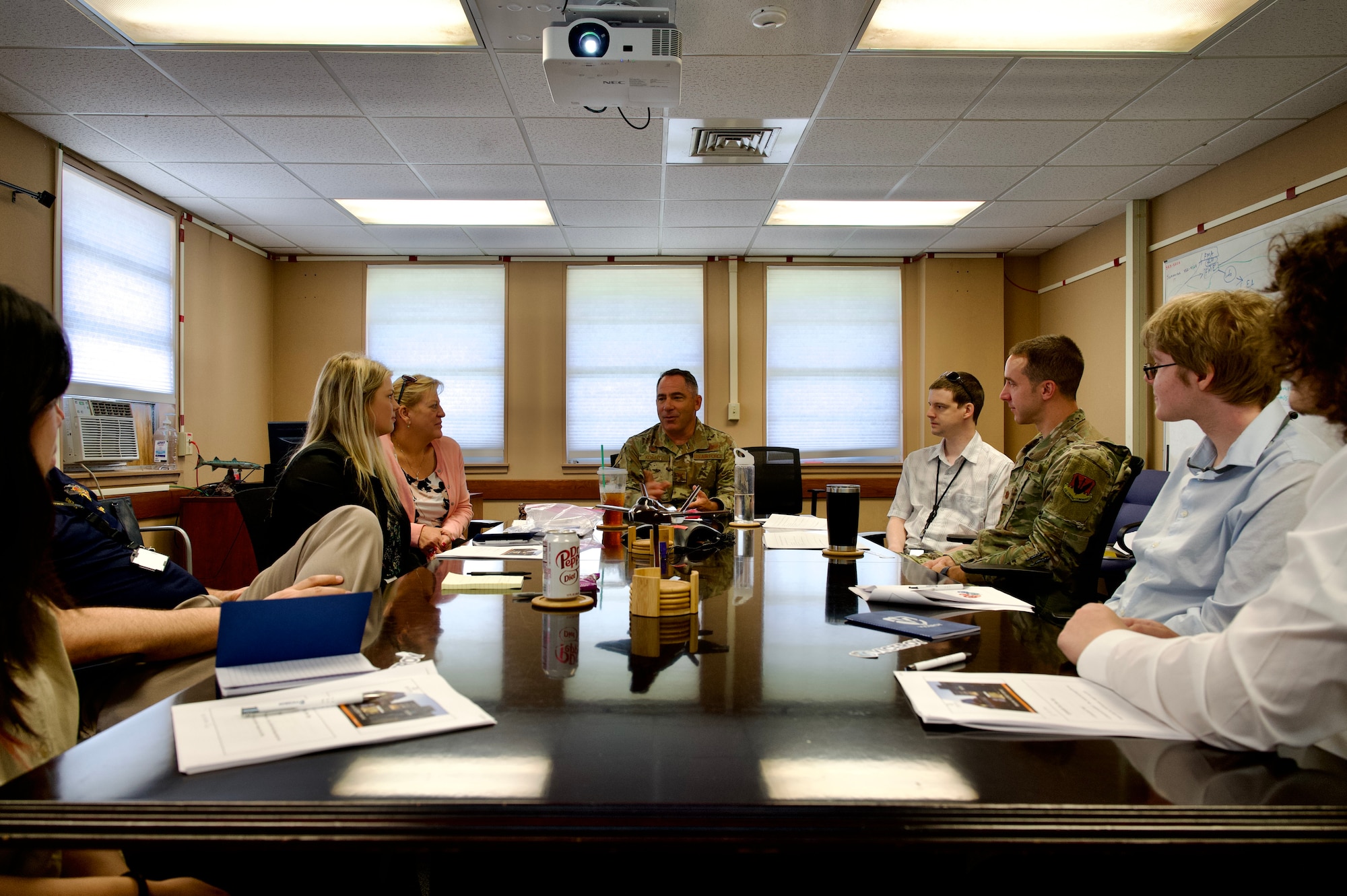 U.S. Air Force Col. Josh Koslov, 350th Spectrum Warfare commander, center, briefs interns that are part of the Virtual Institutes for Cyber and
Electromagnetic Spectrum Research and Employ (VICEROY) Program about the wing mission at Eglin Air Force Base, Fla., June 5, 2023. The VICEROY Program allows for college students to work at DoD organizations to get hands on training and experience with critical missions to prepare them for a potential future career with the government. (U.S. Air Force photo by 1st Lt. Benjamin Aronson)