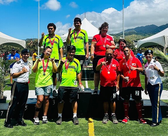 Service members assigned to Joint Task Force-Red Hill gather after participating in the Torch Run, marking the beginning of the 2023 Hawaii Special Olympics held in Honolulu, June 9th 2023.