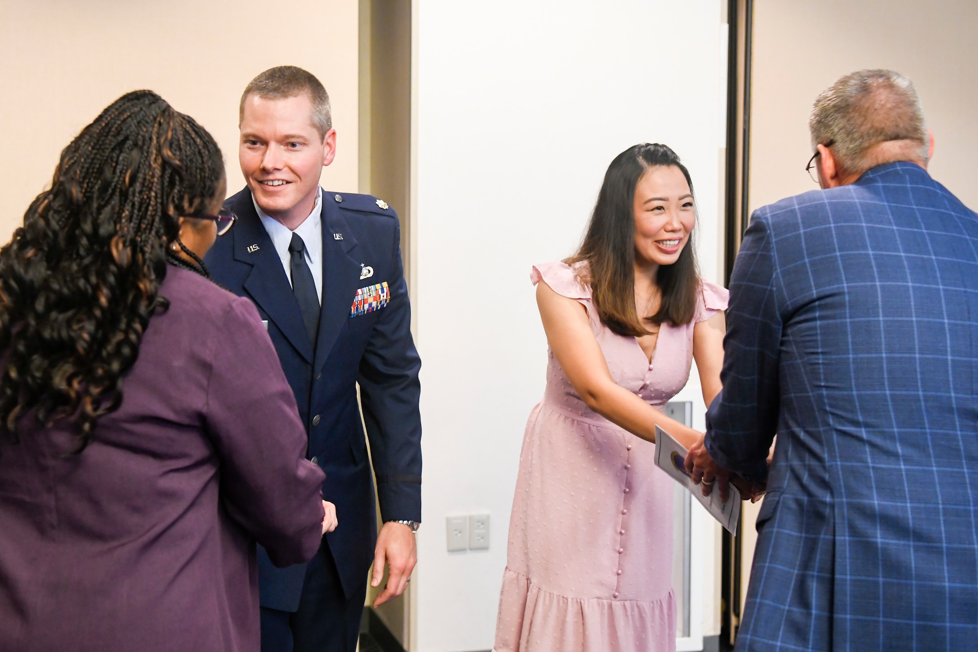 Maj. Tim Krystosek and his spouse, Peachy, greet members of the Yokota community.