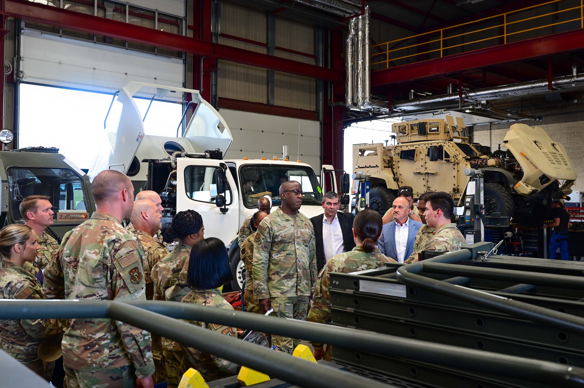 U.S. Air Force Lt. Gen. Stacey T. Hawkins, Air Force Sustainment Center commander, center, tours 86th Materiel Maintenance Squadron assets at Sanem, Luxembourg, June 8, 2023. Hawkins toured the 86th MMS to understand their role in maintaining U.S. Air Forces in Europe’s largest supply of war readiness materiels.  (U.S. Air Force photo by Senior Airman Andrew Bertain)