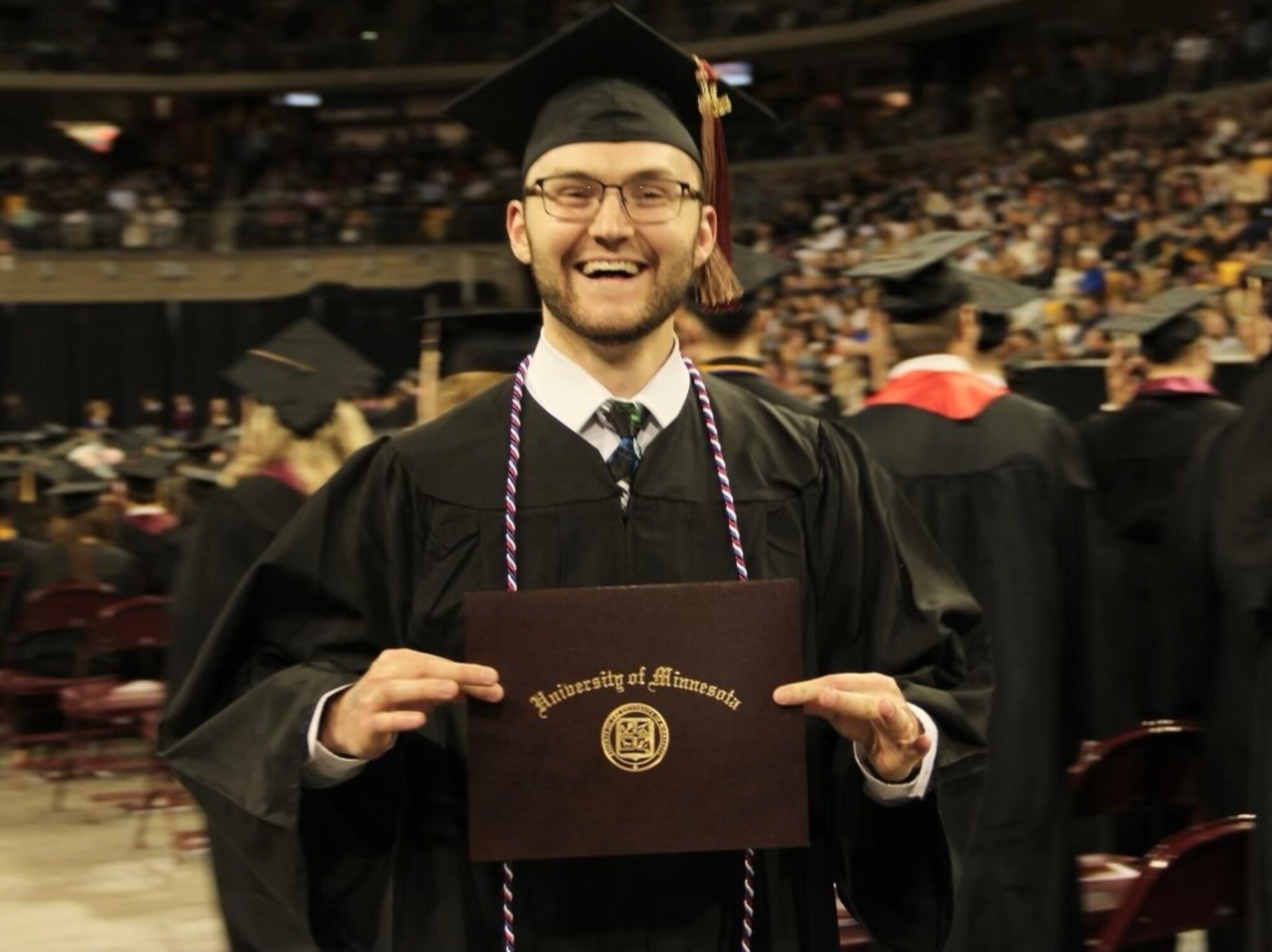 Services Specialist, Staff Sgt. Ben Churchill, assigned to the 148th Fighter Wing's Force Support Squadron, Minnesota Air National Guard, poses for a photo during his graduation commencement from the University of Minnesota - Duluth on May 6, 2023. Churchill earned both a Bachelor of Business Administration in Human Resource Management and a Bachelor of Arts in Communications with a Minor in Psychology using the benefits he earned by joining the Minnesota Air national Guard.