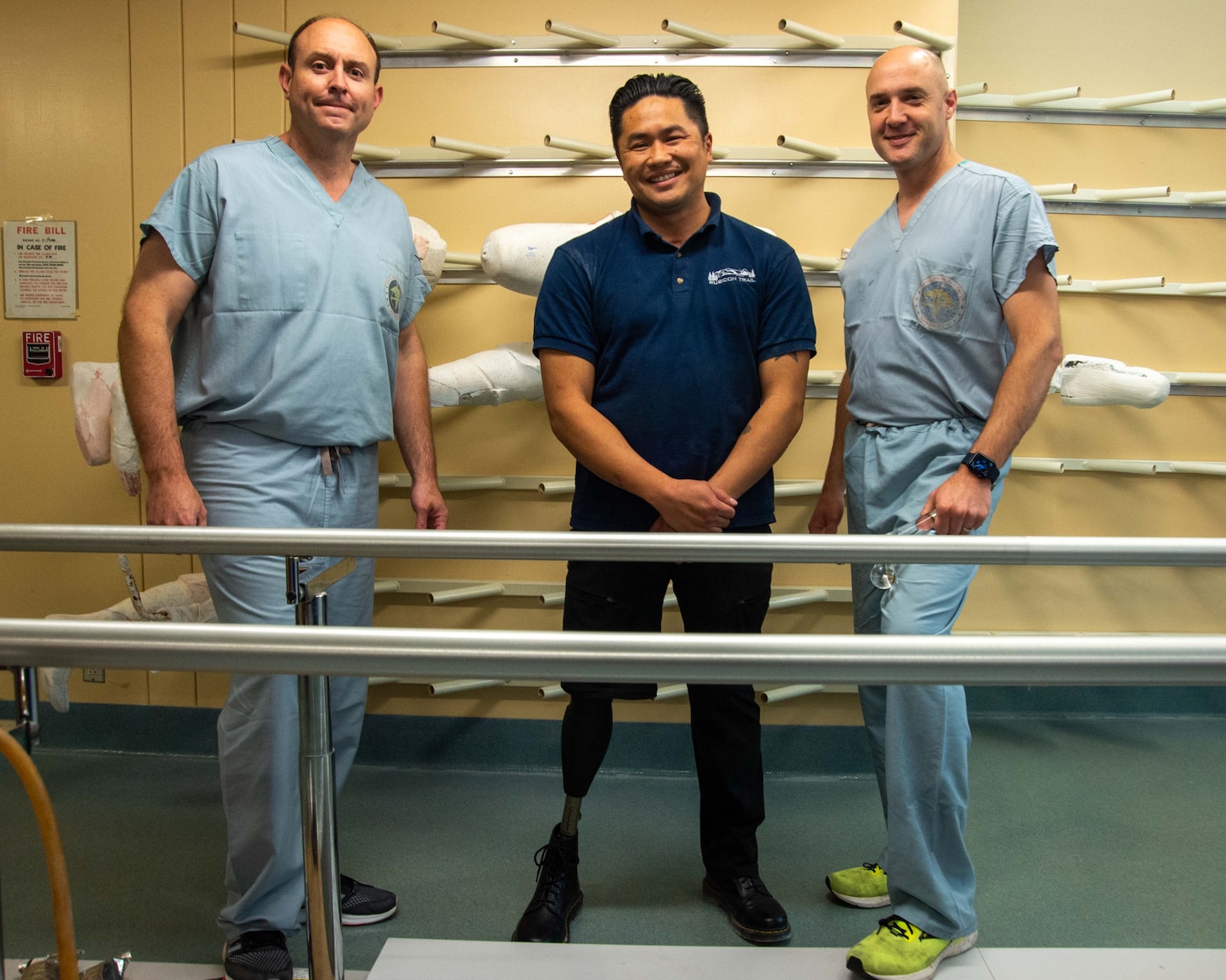 SAN DIEGO (May. 24, 2023) Naval Medical Center San Diego's (NMCSD) Osseo-Prosthetics team, comprised of Cmdr. Yan Ortiz-Pomales, specialty leader for Plastic Surgery in the Navy, left, Nathaniel Ortiz, Lead Prosthetist, center, and Cmdr. James Flint, NMCSD Orthopedic Oncology Surgeon, right, pose for a group photo. NMCSD's mission is to prepare service members to deploy in support of operational forces, deliver high quality healthcare services and shape the future of military medicine through education, training and research. NMCSD employs more than 6,000 active duty military personnel, civilians and contractors in Southern California to provide patients with world-class care anytime, anywhere. (U.S. Navy photo by Mass Communication Specialist Seaman Raphael McCorey)
