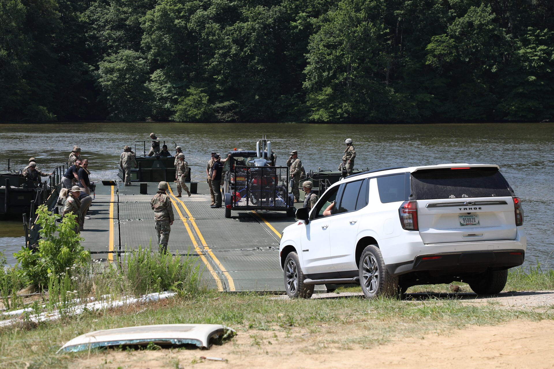 Soldiers from the Kentucky National Guard’s 2061st Multi-Role Bridge Company load vehicles onto their raft bridge