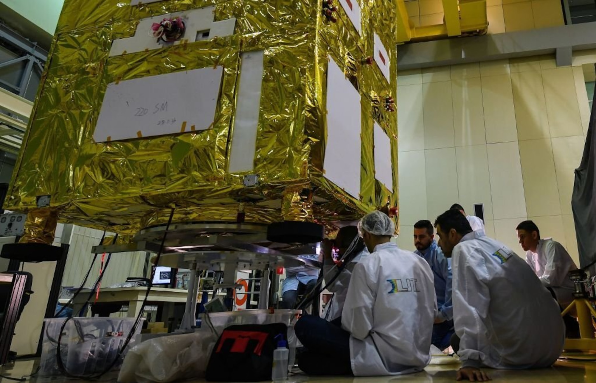 Brazilian researchers work on the Earth Resources Satellite (CBERS-4A), a cooperation programme between Brazil's National Institute for Space Research (INPE) and China's Academy of Space Technology (CAST), at the Integration and Testing lab at the INPE headquarters, in Sao Jose dos Campos, some 90 km north of Sao Paulo, Brazil, on December 5, 201