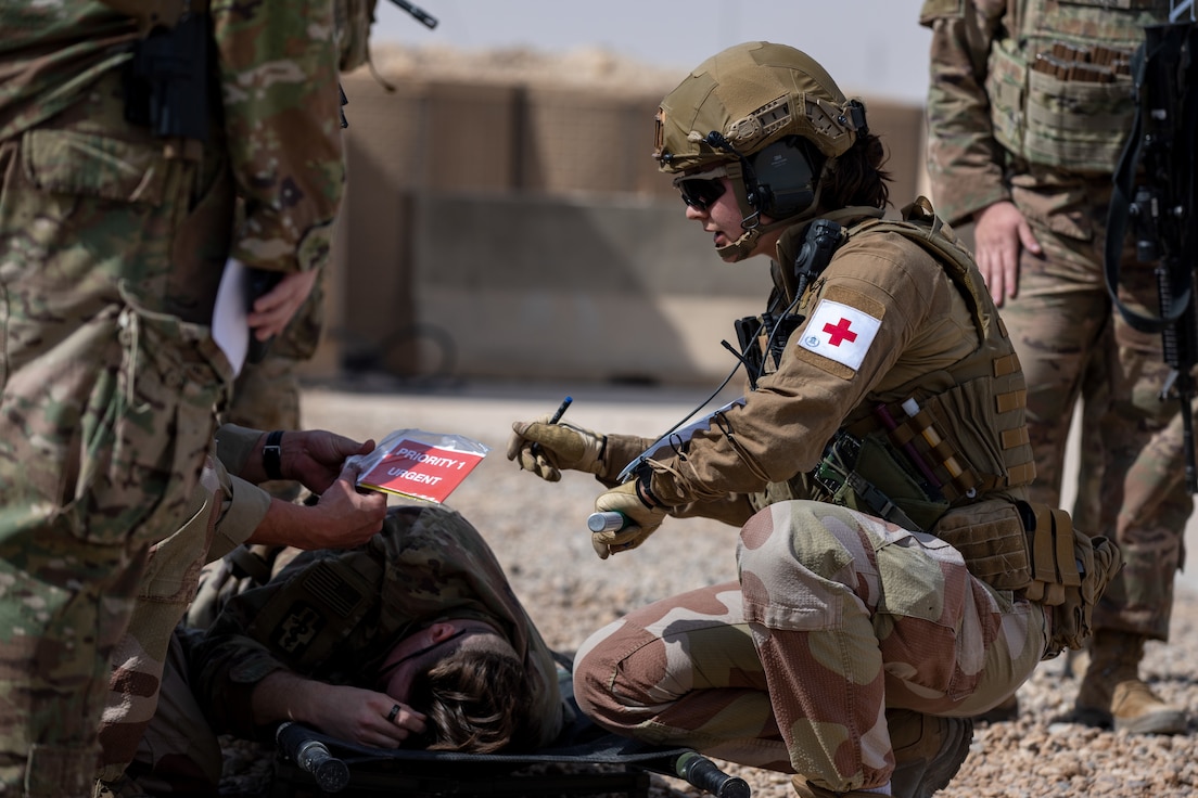 A Norwegian solider assigned to Norwegian Engineer Battalion, Task Force Viking, Combined Joint Task Force – Operation Inherent Resolve, treats a simulated casualty during a training exercise, Al Asada Air Base, Iraq, March 3, 2023. Members of Combined Joint Task Force – Operation Inherent Resolve train together to maintain readiness and proficiency to continue to advise assist and enable partner forces.(U.S. Army photo by Sgt. Julio Hernandez)