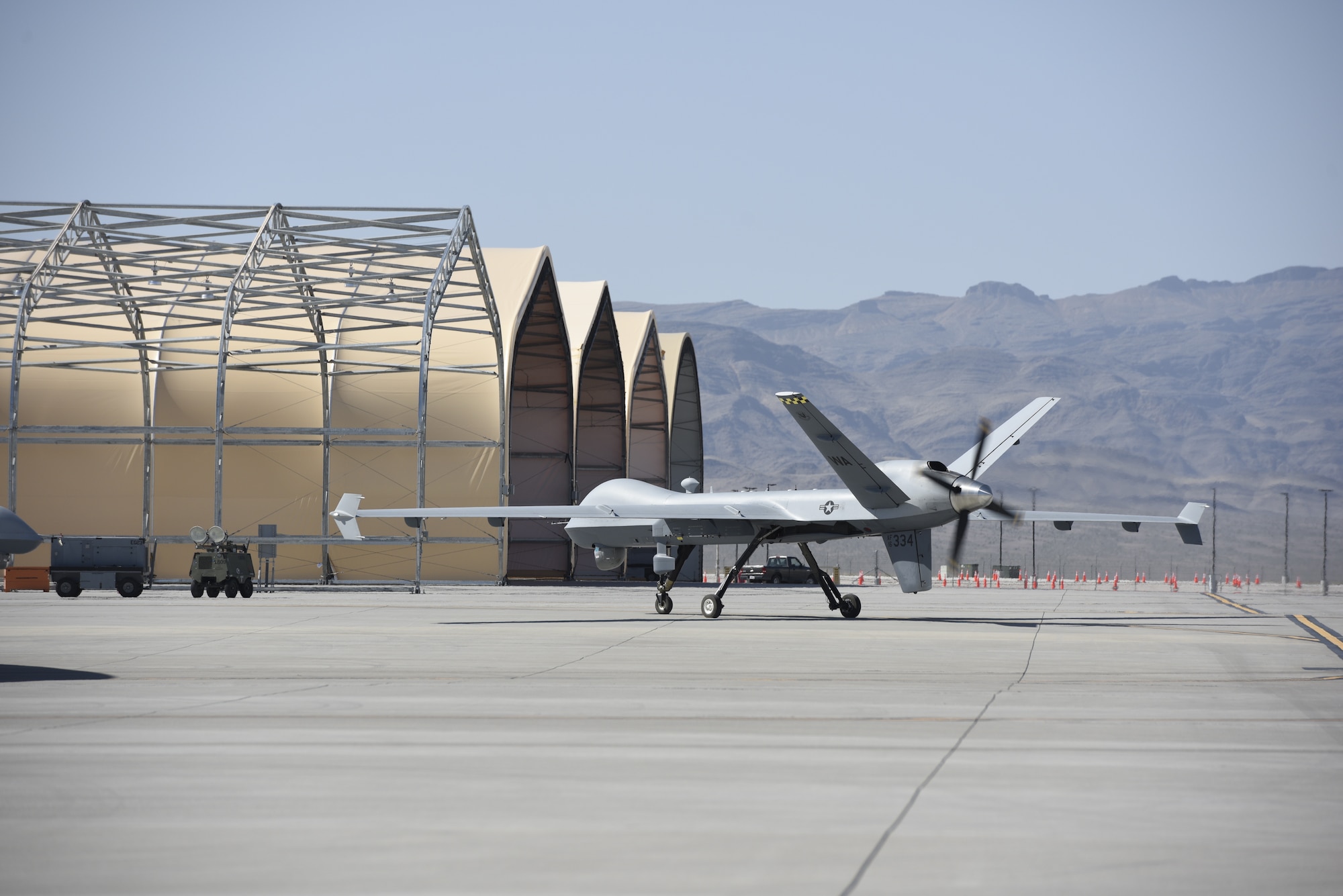 An unmanned aircraft taxis down a runway.