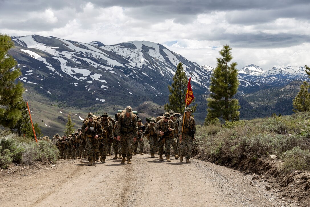 Marines with 2/23 conduct a conditioning hike during MTX 4-23