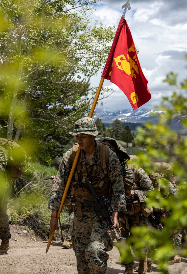 U.S. Marine Corps Lance Cpl. Eduardo Taximaroa, a machine gunner with Golf Company, 2nd Battalion, 23d Marine Regiment, 4th Marine Division, carries the guidon during a conditioning hike during Mountain Training Exercise 4-23 at Marine Corps Mountain Warfare Training Center in Bridgeport, California, June 13, 2023. Marines begin MTX by conducting conditioning hikes to acclimate to their environment in preparation for increasingly difficult training that will prepare them for the challenges of operating in a mountainous environment. (U.S Marine Corps photo by Lance Cpl. Samwel Tabancay)
