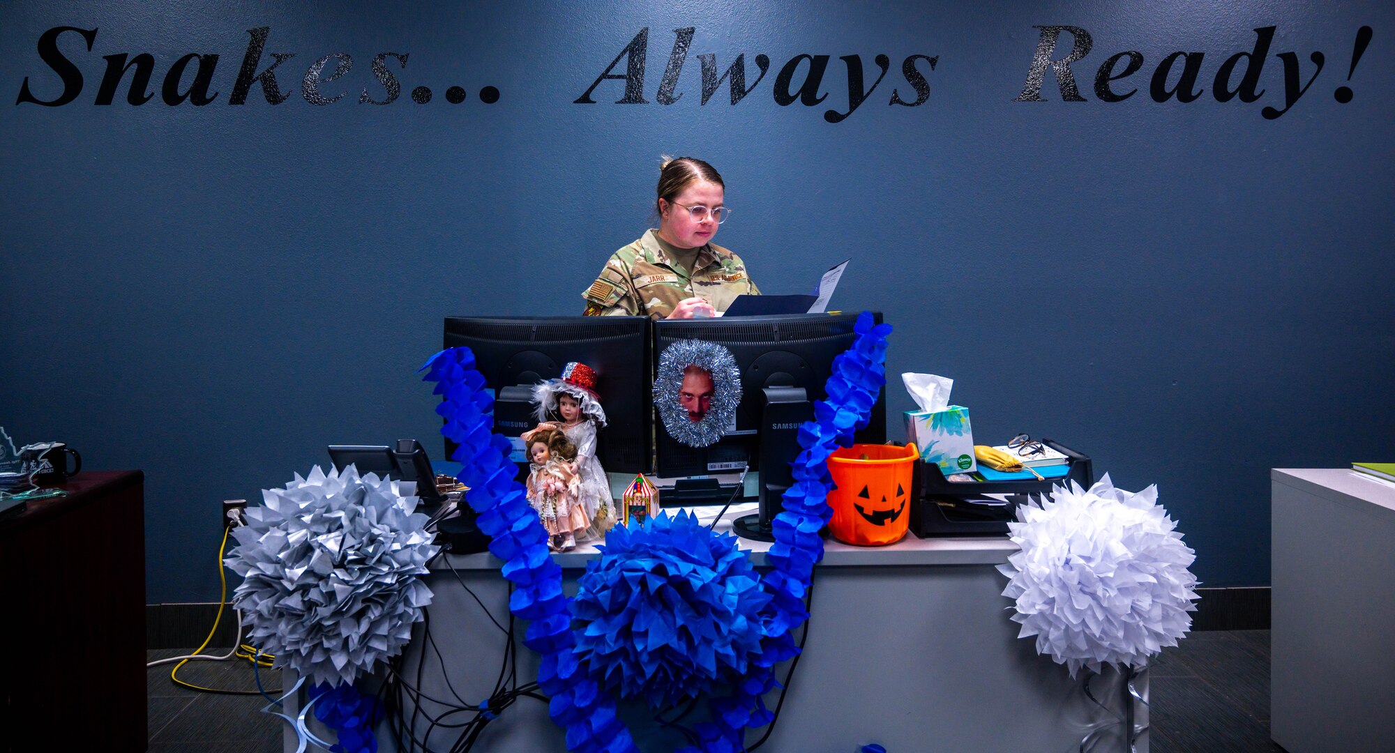 U.S. Air Force Master Sgt. Maria Jarr, 607th Air Control Squadron flight chief, reviews a file at her desk, May 18, 2023, at Luke Air Force Base, Arizona.
