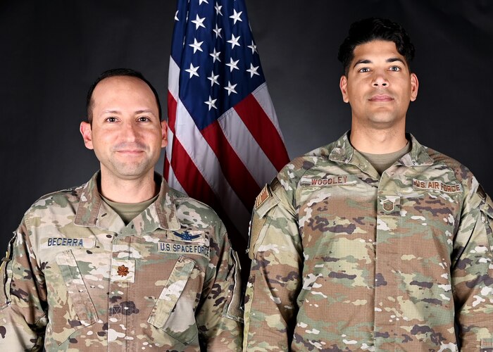 U.S. Space Force Maj. Emilio Becerra, 12th Air Force (Air Forces Southern) deputy director of Space Forces, left, and U.S. Air Force Master Sgt. Vincent Woodley, 12th Air Force (Air Forces Southern) intelligence advisor to the director of Space Forces, right, are at Davis-Monthan Air Force Base, Ariz., June 14, 2023. Becerra and Woodley united Air Force intelligence support with Space Force operational capabilities, which demonstrated how U.S. Southern Command overcame obstacles by combining capabilities of the two services. (U.S. Air Force photo by Staff Sgt. Abbey Rieves)