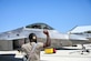 Maintainer marshals a jet.