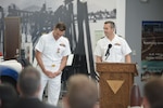 Cmdr. Carlos Evans relieves Cmdr. Paul Parsoneault as the commanding officer of the Fleet Logistics Support Squadron Five Five (VR-55) during a change of command ceremony held at the Seabee Museum onboard Naval Base Ventura County (NBVC), Port Hueneme. NBVC is a strategically located Naval installation composed of three operating facilities: Point Mugu, Port Hueneme and San Nicolas Island. NBVC is the home of the Pacific Seabees, West Coast E-2D Hawkeyes, 3 warfare centers and 80 tenants. (U.S. Navy photo by Mass Communication 1st Class Douglas 