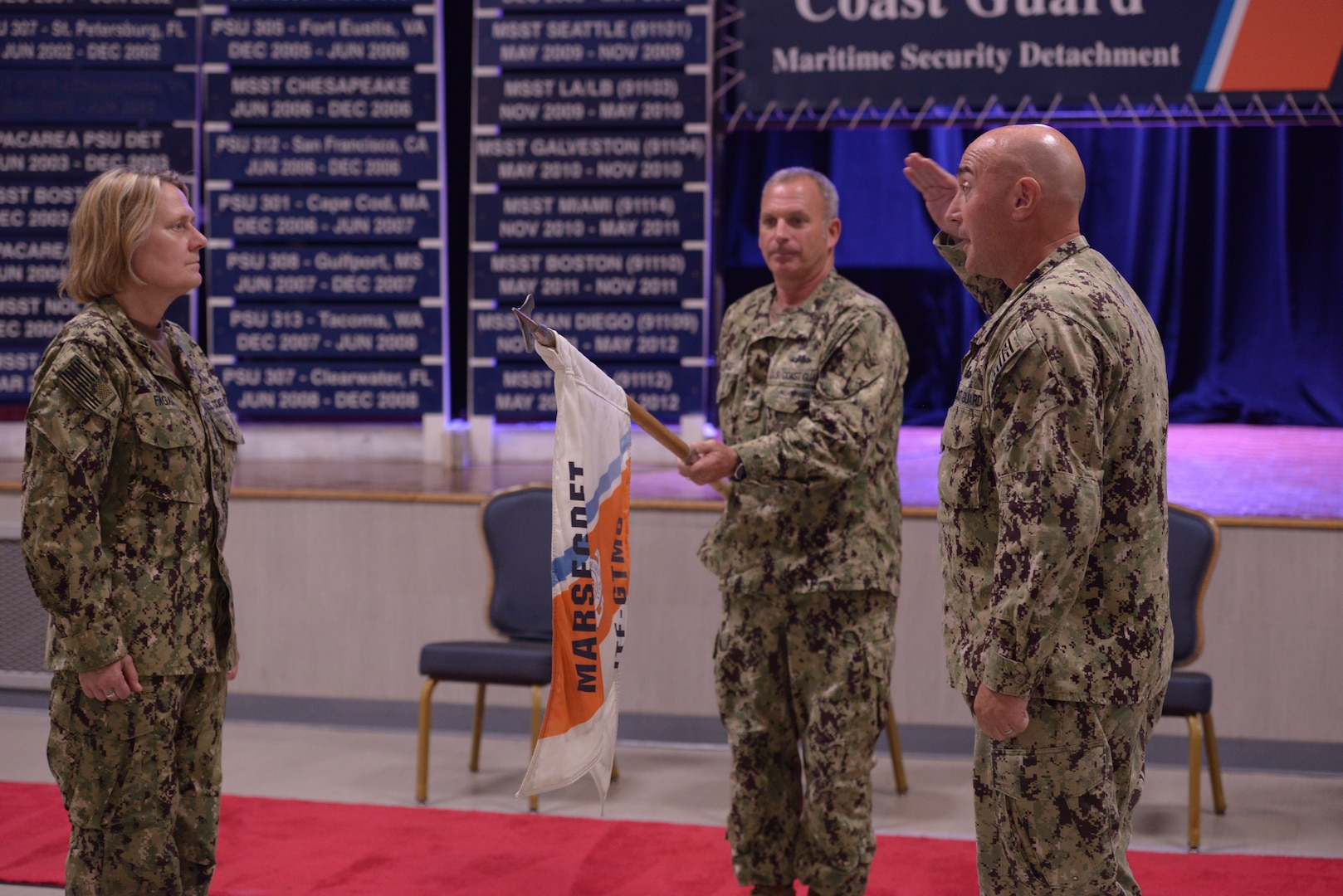 U.S. Coast Guard Cmdr. James Lovenstein, Port Security Unit (PSU) 305’s commanding officer, salutes Coast Guard Commandant Adm. Linda Fagan and requests permission to decommission PSU 305 after its nine-month mission serving at Joint Task Force Guantanamo Bay (JTF-GTMO) as the Maritime Security Detachment (MARSECDET) during the casing of the colors ceremony at Naval Station Guantanamo Bay, Cuba, June 13, 2023.

PSUs are a Coast Guard deployable specialized force that have served JTF-GTMO as the MARSECDET for over 21 years. The Virginia-based PSU was the first deployed to Guantanamo Bay in 2002 in support of Operation Enduring Freedom, and this tour completes their fifth unit deployment. (U.S. Coast Guard photo by Petty Officer 1st Class Valerie Higdon)