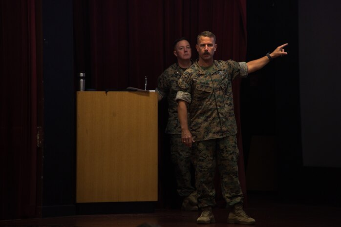 U.S. Marine Corps Chief Warrant Officer 5 Pete "Misfire" Scarlett, Explosives Ordnance Disposal (EOD) Officer for Headquarters Battalion, Marine Corps Base Hawaii, speaks to service members who occupy the EOD field, Marine Corps Air Station Kaneohe Bay, Marine Corps Base Hawaii, 6 June, 2023. The U.S. Marine Corps hosted the annual Joint EOD Symposium for 2023 to streamline current processes and constructs and discuss future capabilities throughout the Department of Defense. (U.S. Marine Corps photo by Cpl. Logan Beeney)