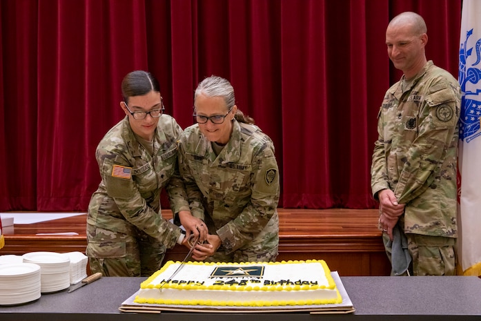 (From left to right) Joint Task Force Red-Hill (JTF-RH) information systems technician, U.S. Army Spec. Jessica Douglass, JTF-RH Deputy Commander, U.S. Army Brig. Gen. Michelle Link, and JTF-RH Army element senior enlisted leader, Sgt. 1st Class Bruce Zolman, celebrate the 248th U.S. Army birthday with a cake-cutting ceremony at task force headquarters on Ford Island, Hawaii, June 14, 2023.