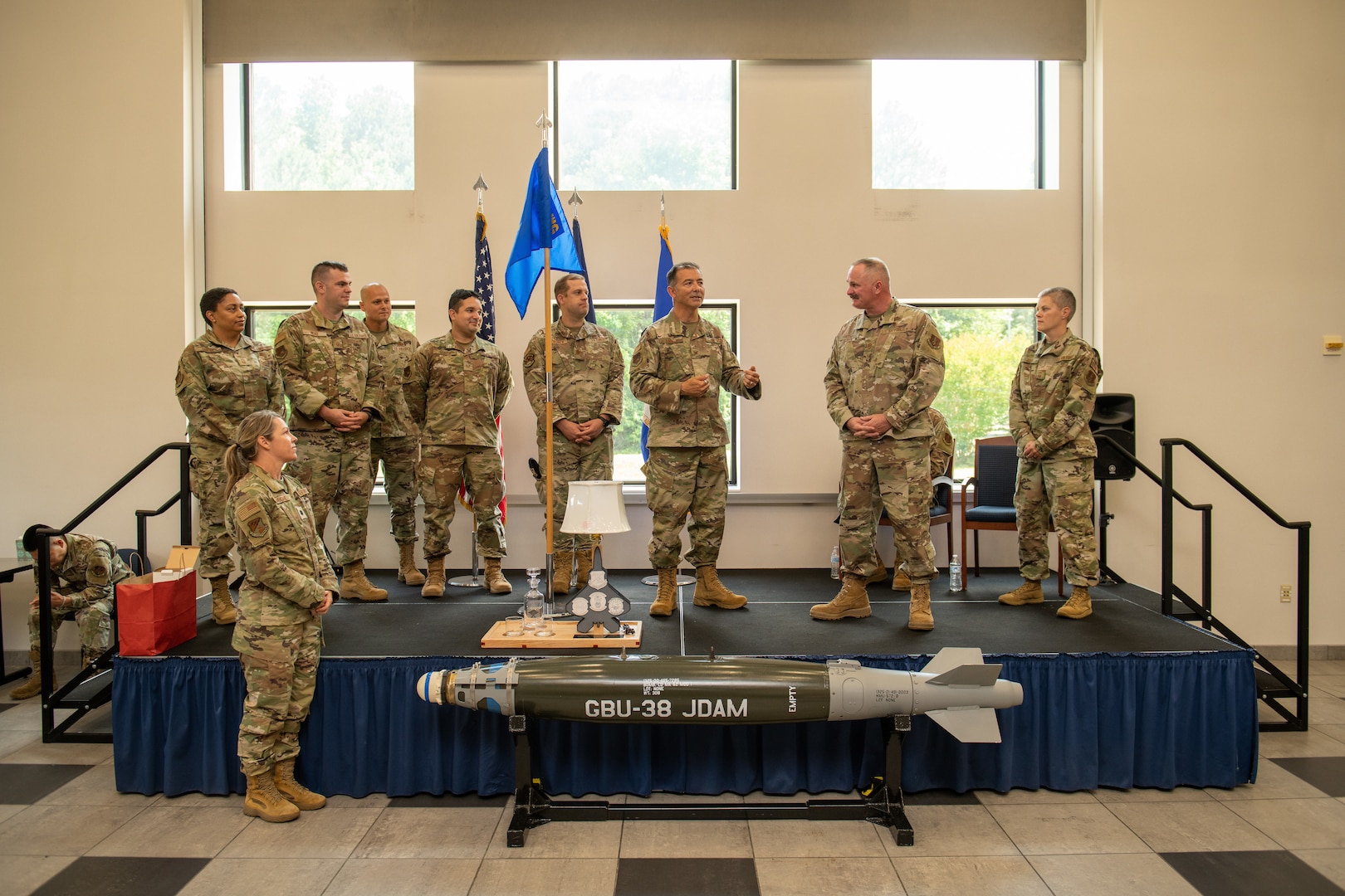 Members from 192nd Mission Support Group present Chief Fretwell with a gift on stage