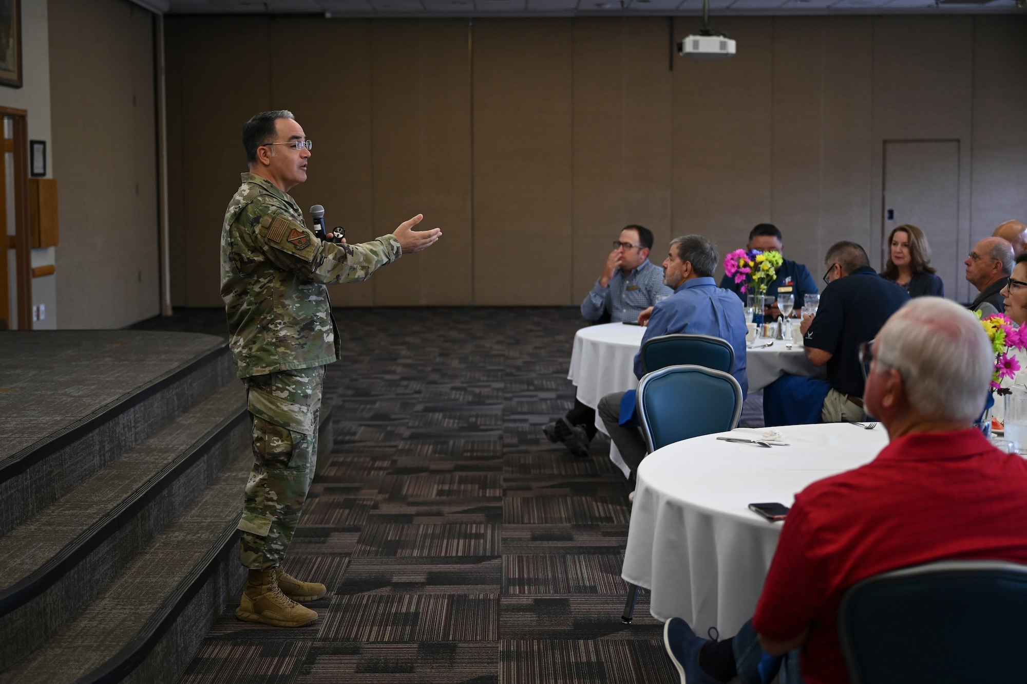 A man briefs a group of people.
