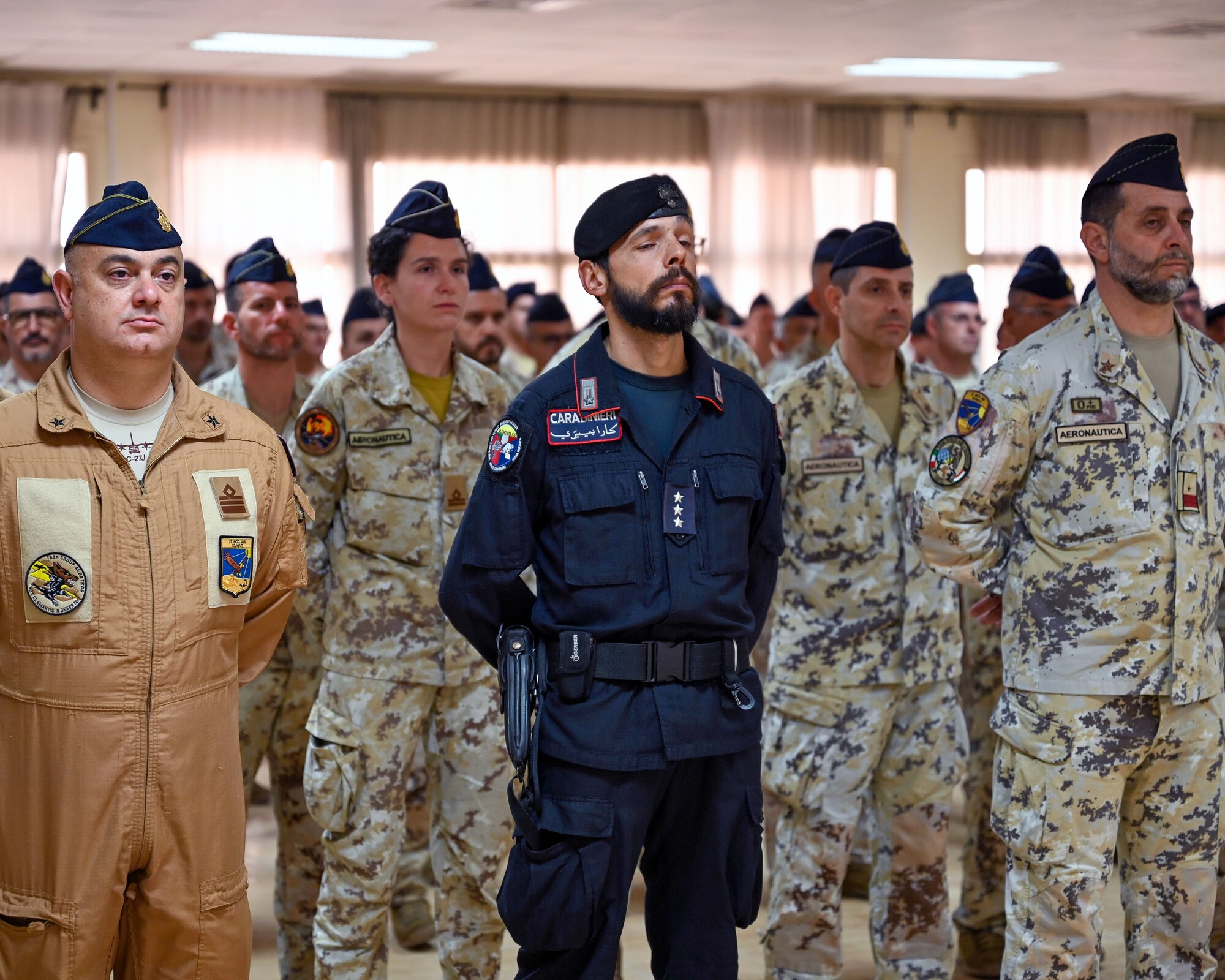 Members of the Italian Air Force participate in a change of command ceremony for the Italian forces at Ali Al Salem Air Base, Kuwait, June 8, 2023. The ceremony highlighted the true friendships that have been built over the last year between the Italian and U.S. Forces. (U.S. Air Force photo by Staff Sgt. Breanna Diaz)