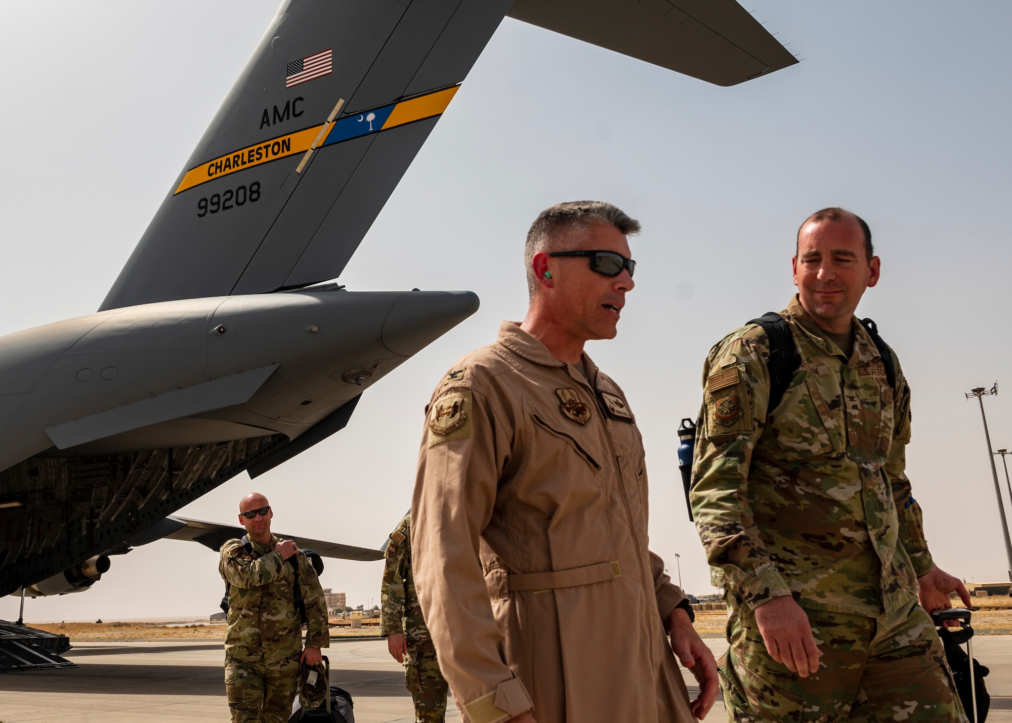 U.S. Air Force Col. George Buch, 386th Air Expeditionary Wing commander, left, welcomes Col. Michael Freeman, 628th Air Base Wing and Joint Base Charleston commander, at Ali Al Salem Air Base, Kuwait, 11 June 2023