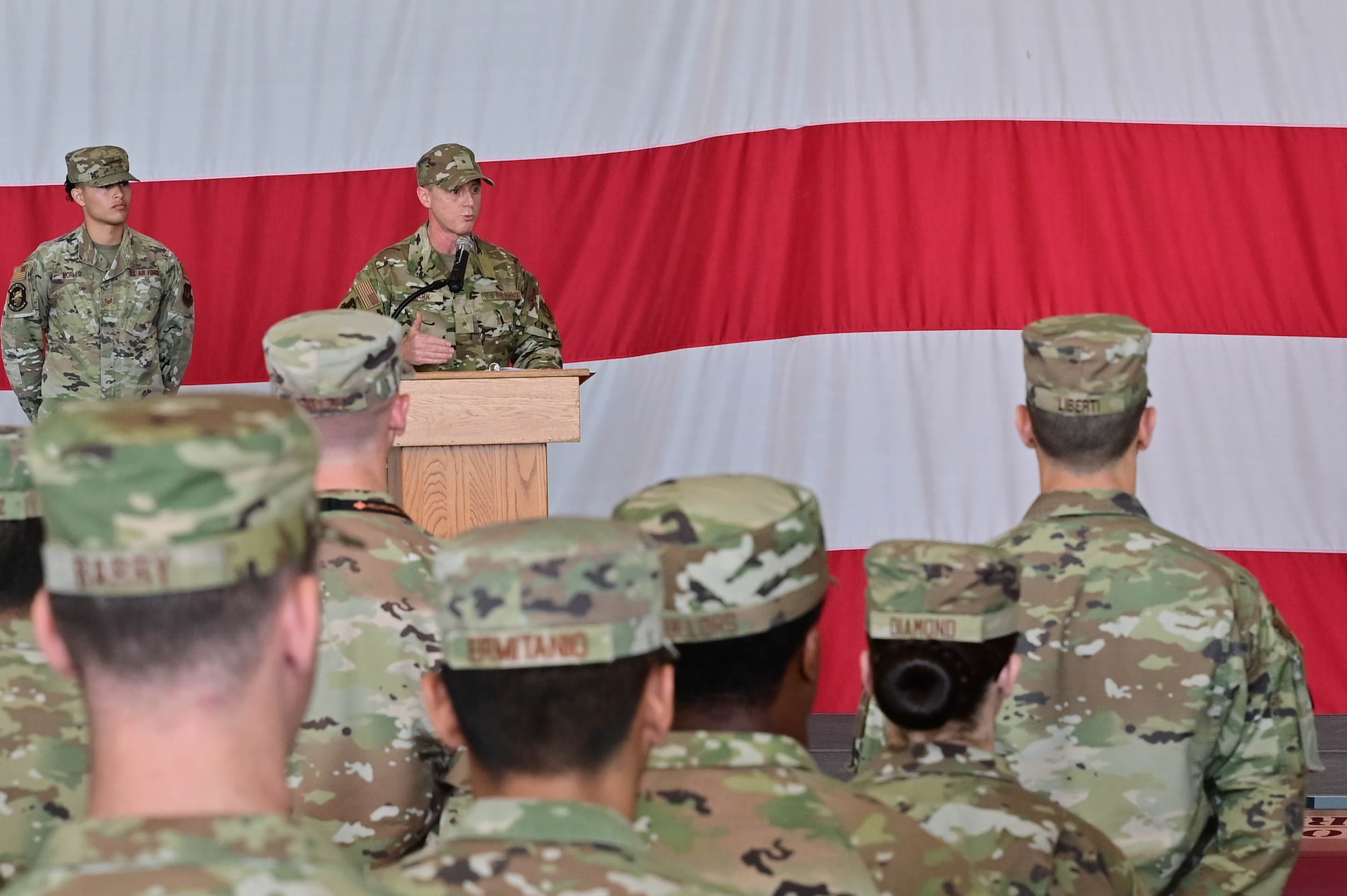 U.S. Air Force Brig. Gen. Tad Clark, 31st Fighter Wing commander, gives a speech to the 31st Maintenance Group during a change of command ceremony at Aviano Air Base, Italy, June 15, 2023. The 31st Maintenance Group manages Europe’s largest munitions stockpile of 3.94 million items valued at $598 million. (U.S. Air Force photo by Airman Zachary Jakel)