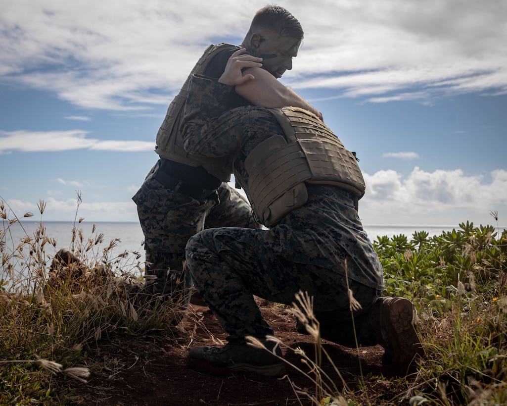 U.S. Marine Corps GySgt. David A. Waterfield Jr., Training Chief, Marine Corps Aircraft Rescue and Firefighter Specialist, Aircraft Rescue Firefighting, Marine Corps Air Station Kaneohe Bay, left, and U.S. Marine Corps Cpl. Cody T. Purcell, Videographer, Headquarters Battalion, U.S. Marine Corps Base Kaneohe Bay Hawaii, right, grapple during the culminating event of a Martial Arts Instructor course on Marine Corps Base Hawaii, June 9, 2023. MAI courses certify Marines to instruct and monitor Marine Corps Martial Arts Program training and advance Marines in belt levels. MCMAP is a synergy of mental, character, and physical disciplines, and in concert with Marine Corps leadership principles, training in these three disciplines enhances the Marine both on and off the battlefield.