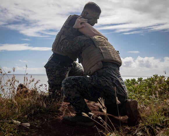 U.S. Marine Corps GySgt. David A. Waterfield Jr., Training Chief, Marine Corps Aircraft Rescue and Firefighter Specialist, Aircraft Rescue Firefighting, Marine Corps Air Station Kaneohe Bay, left, and U.S. Marine Corps Cpl. Cody T. Purcell, Videographer, Headquarters Battalion, U.S. Marine Corps Base Kaneohe Bay Hawaii, right, grapple during the culminating event of a Martial Arts Instructor course on Marine Corps Base Hawaii, June 9, 2023. MAI courses certify Marines to instruct and monitor Marine Corps Martial Arts Program training and advance Marines in belt levels. MCMAP is a synergy of mental, character, and physical disciplines, and in concert with Marine Corps leadership principles, training in these three disciplines enhances the Marine both on and off the battlefield.
