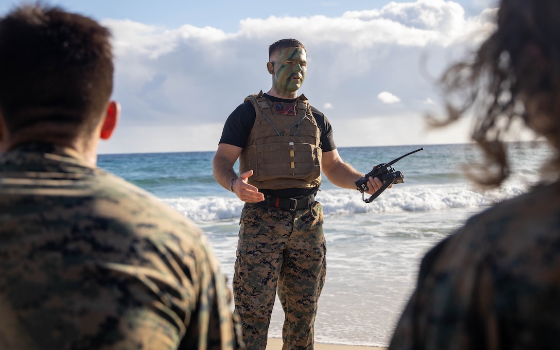 U.S. Marine Corps GySgt. David A. Waterfield Jr., Training Chief, Marine Corps Aircraft Rescue and Firefighter Specialist, Aircraft Rescue Firefighting, Marine Corps Air Station Kaneohe Bay leads a period of instruction during the culminating event of a Martial Arts Instructor course on Marine Corps Base Hawaii, June 9, 2023. MAI courses certify Marines to instruct and monitor Marine Corps Martial Arts Program training and advance Marines in belt levels. MCMAP is a synergy of mental, character, and physical disciplines, and in concert with Marine Corps leadership principles, training in these three disciplines enhances the Marine both on and off the battlefield.