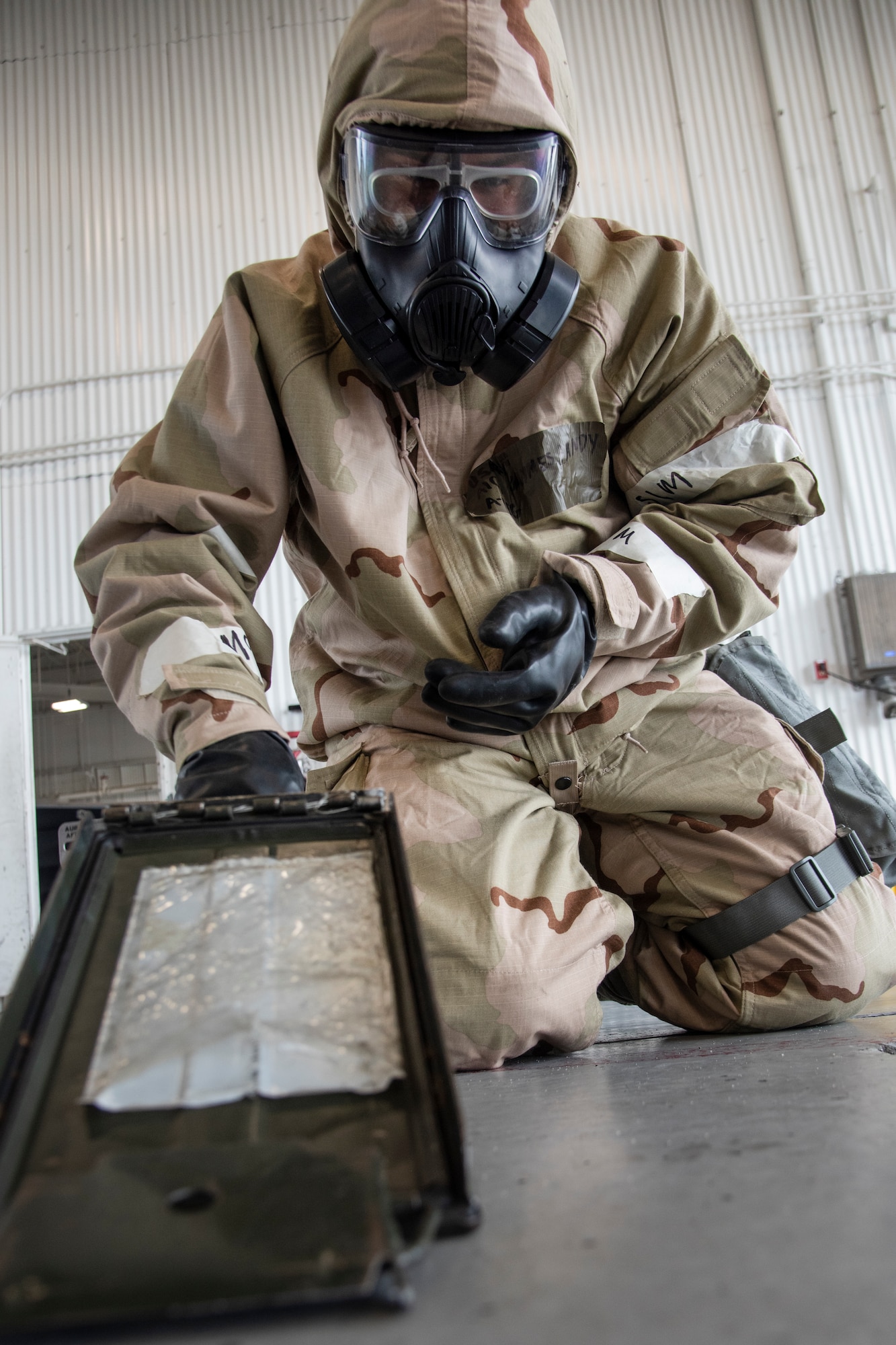 Airman 1st Class Jean Vega-Lopez, 336th Fighter Generation squadron weapons load crew member, wears chemical, biological, radiological, nuclear, and explosive (CBRNE) gear during a weapons standardization load evaluation.