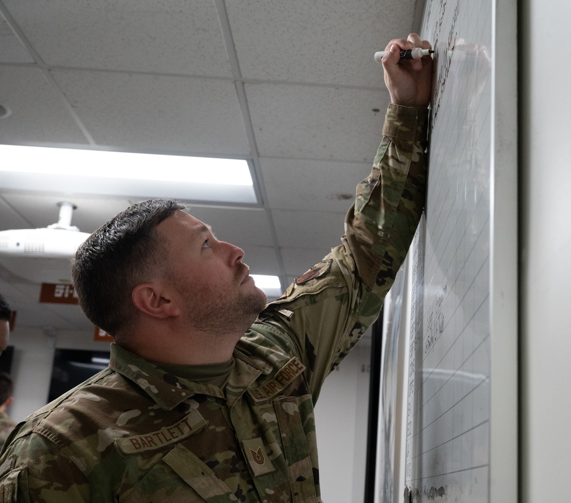 Airmen partake in a hurricane crisis exercise at the Emergency Operations Center.
