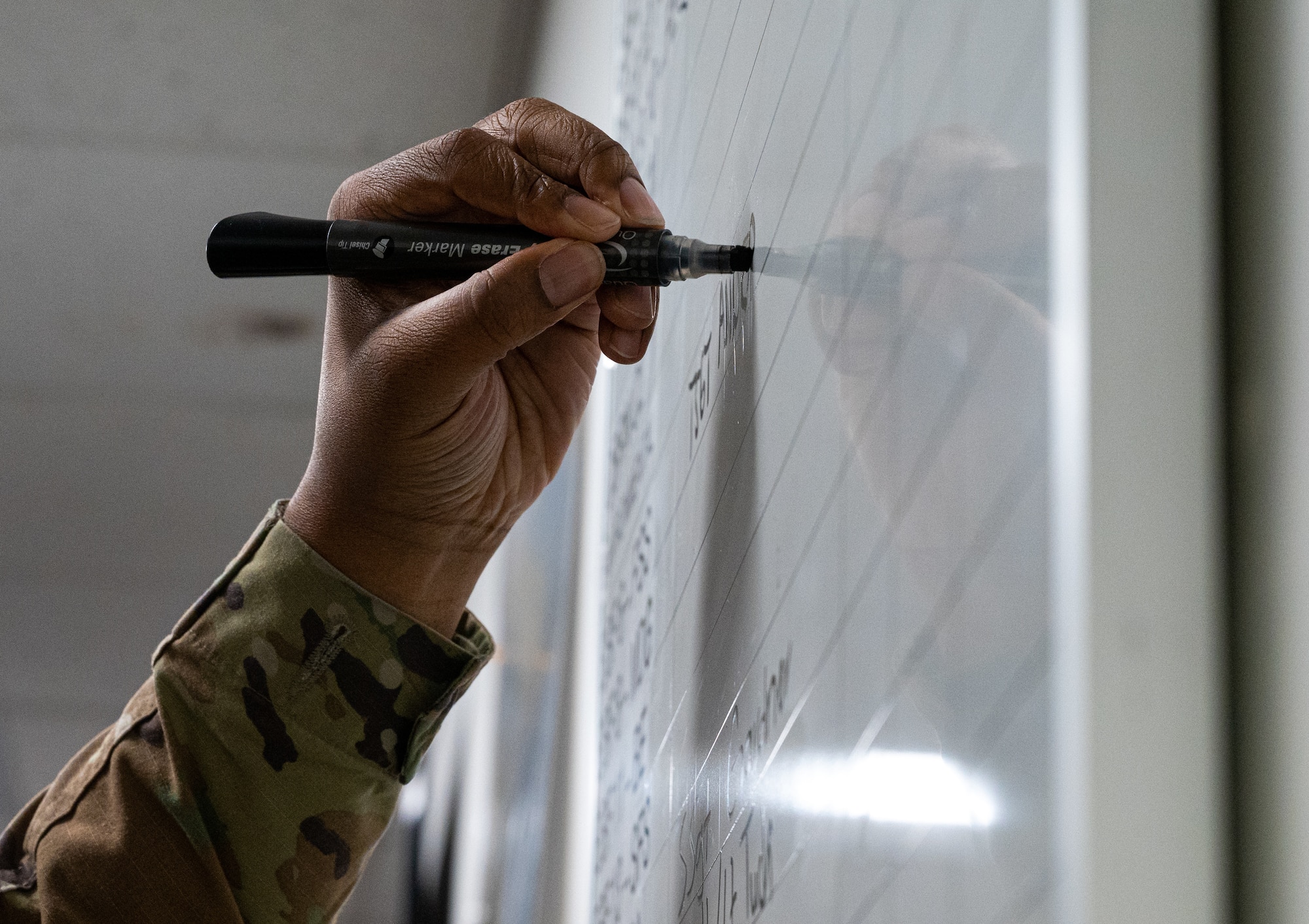 Airmen partake in a hurricane crisis exercise at the Emergency Operations Center.